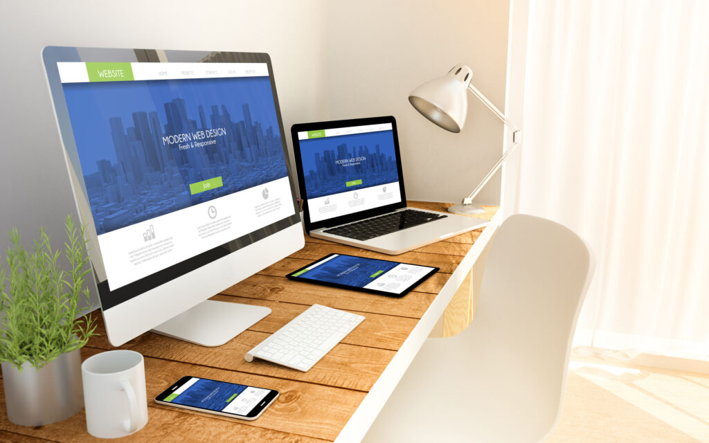 Image of computers and portable devices on a desktop - Field 1 Post Digital Marketing