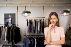 Image of woman thinking in clothing store