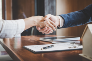 Image of people shaking hands.